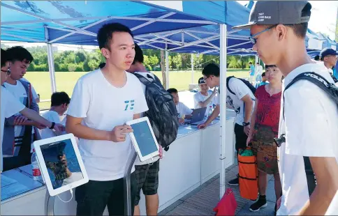  ?? YU ZHENHUA / FOR CHINA DAILY ?? A freshman registers with the help of facial recognitio­n technology at Beihang University in Beijing in August.