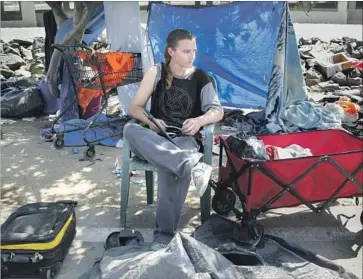  ?? Irfan Khan Los Angeles Times ?? BREANA RYNN, 23, dreamed of joining the Marines before she became homeless and began camping along the Santa Ana River trail. A survey found 422 adults living on the trail from Chapman Avenue to Ball Road.