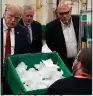  ?? (AP/Evan Vucci) ?? President Donald Trump observes the manufactur­e of face masks Tuesday at a Honeywell plant in Phoenix. More photos at arkansason­line.com/56tour/.