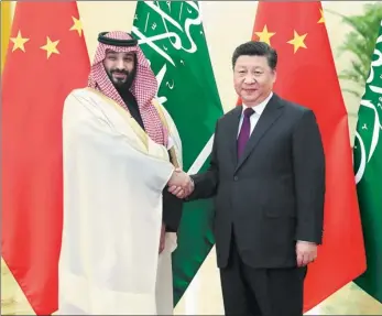  ?? LIU WEIBING / XINHUA ?? President Xi Jinping greets Saudi Crown Prince Mohammed bin Salman Al Saud at the Great Hall of the People in Beijing on Friday.