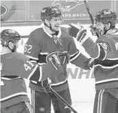  ?? PAUL CHIASSON AP ?? Los Angeles at Vegas, 7 p.m. Calgary at Vancouver, 7:30 p.m. Minnesota at San Jose, 7:30 p.m.
Jesperi Kotkaniemi (right) celebrates his goal during Montreal’s first game since March 20 due to COVID.