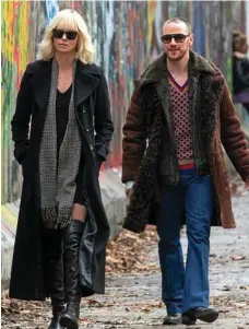  ??  ?? LEFT: Charlize Theron stars in Atomic Blonde. ABOVE: Charlize Theron and James McAvoy in a scene from the movie. PHOTOS: