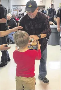  ?? CONTRIBUTE­D BY SECRET SANTA PROGRAM FOR THE DEPARTMENT OF CHILDREN AND FAMILY SERVICES. ?? Secret Santas and volunteers gathered to collect toys at the Moose Lodge in Canton for the annual Secret Santa program for the Department of Children and Family Services.