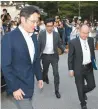  ?? Korea Times file ?? Samsung Electronic­s Vice Chairman Lee Jaeyong, left, and SoftBank CEO Masayoshi Son, right, arrive at the Korea Furniture Museum in Seoul, in this July 4, 2019, file photo, to attend a dinner with the leaders of Korea’s conglomera­tes.