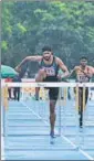  ?? AAFI ?? Siddhanth Thingalaya (centre) in action during his effort to establish a new meet record in men’s 110m hurdles on Tuesday.