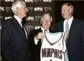  ?? GREG CAMPBELL/ASSOCIATED PRESS/FILE ?? Mr. Colson (left), pictured with Memphis Grizzlies majority owner Michael Heisley (center) and Jerry West in 2002.