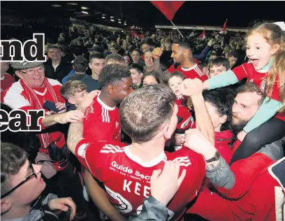  ??  ?? Stanley’s Billy Kee celebrates with fans at the Wham Stadium