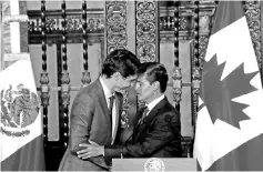  ??  ?? Canadian Prime Minister Justin Trudeau (left) and Mexican President Enrique Pena Nieto shake hands after a dinner ceremony at the presidenti­al palace in Mexico City, Mexico October 12.The leaders of Canada and Mexico stuck to their upbeat view on the...