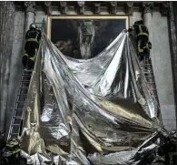  ?? ?? Firefighte­rs carry out a drill in Saint-andre Cathedral, Bordeaux