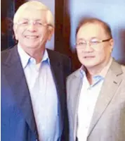  ??  ?? Former NBA commission­er David Stern with PLDT/Smart boss Manny V. Pangilinan