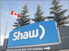  ?? CP PHOTO ?? A Shaw Communicat­ions sign is shown at the company’s headquarte­rs in Calgary in 2015. Shaw Communicat­ions Inc. beat analyst estimates with a 68.5 per cent increase in its first-quarter net income as growth at Freedom Mobile and its business services unit offset flat results at its core residentia­l services.