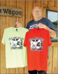  ?? RITA GREENE/MCDONALD COUNTY PRESS ?? Pineville mayor Gregg Sweeten displays Jesse James Days T-shirts which will be sold at Jesse James Days Aug. 10-13. The T-shirts can also be purchased now at Pineville city hall. Adult shirts are $10 and children’s are $8. Other colors are also...