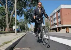  ??  ?? Councillor Denzil Minnan-Wong, chair of Toronto’s public works committee, says Sherbourne St.’s bike lanes have been a success.