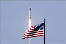  ?? JOHN RAOUX — THE ASSOCIATED PRESS ?? SpaceX Falcon 9, with NASA astronauts Doug Hurley and Bob Behnken in the Dragon crew capsule, lifts off from Pad 39-A at the Kennedy Space Center in Cape Canaveral, Fla., May 30.