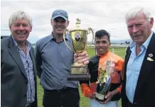  ??  ?? Left: Central Otago Racing Club president Tony Lepper, horse owner and trainer Bevan Wilson, winning jockey Racha Cuneen, and former president Garry McDonnell, with the Clare Memorial Gold Cup in 2017.