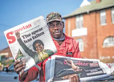  ?? (AFP) ?? A vendor sells newspapers reporting the death of Winnie Mandela, in Johannesbu­rg on Tuesday