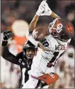  ?? CHARLIE NEIBERGALL/AP ?? Iowa State DB Lawrence White IV breaks up a pass to OU’s Theo Wease during the Cyclones’ win.