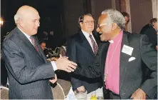  ?? AP ?? South African President F.W. de Klerk shakes hands with Archbishop Desmond Tutu in Johannesbu­rg on Sept. 14, 1991.