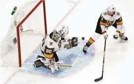  ?? PERRY NELSON/USA TODAY SPORTS ?? Golden Knights goalie Robin Lehner (90) makes a save in front of defenseman Brayden McNabb (3) during the first period on Saturday.