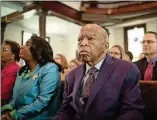  ?? CONTRIBUTE­D ?? In a still from “John Lewis: Good Trouble,” the congressma­n sits in a Texas church before dancing.