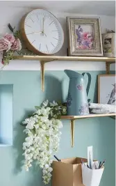  ??  ?? As the house is built on a farm plot, Gillian pays homage to farmhouse living with country chic accessorie­s like this sweet metal jug adorned with flower motifs