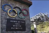  ?? HAVEN DALEY — THE ASSOCIATED PRESS FILE ?? A sign marking the 1960 Winter Olympics is seen by a chairlift at Squaw Valley Ski Resort in Olympic Valley.