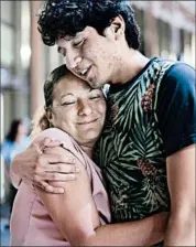  ?? DELCIA LOPEZ/AP ?? Francisco Galicia embraces his mother after being released Tuesday after being wrongfully detained.