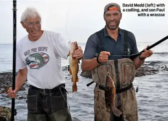  ??  ?? David Medd (left) with a codling, and son Paul with a wrassse