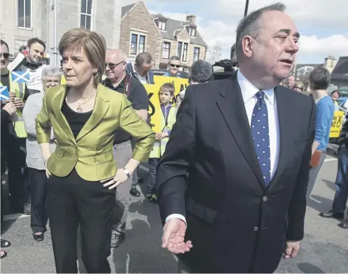  ?? ?? ↑ Nicola Sturgeon with Alex Salmond whilst on the general election campaign trail in Inverurie in the Gordon constituen­cy in 2015