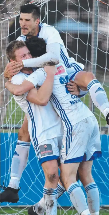  ?? Picture: JAY TOWN ?? READY: Bell Park’s Joshua Berta, Matthew Hagebols and Mijo Marinovic celebrate.