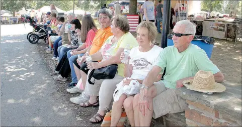  ?? FILE PHOTOS ?? The stonewall along the road at Prairie Grove Battlefiel­d State Park is a popular resting place at the Clotheslin­e Fair each year.