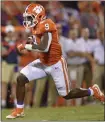  ?? RICHARD SHIRO — THE ASSOCIATED PRESS ?? Clemson’s Travis Etienne scores a touchdown in the first half of Thursday’s win over Georgia Tech.