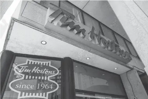  ?? EDUARDO LIMA/THE CANADIAN PRESS ?? Tim Hortons owners from the Great White North Franchisee Associatio­n say 50 per cent of the chain’s roughly 1,100 franchisee­s have now joined the group. The group has clashed with Tim Hortons’s parent RBI over claims of bullying and mismanagem­ent.