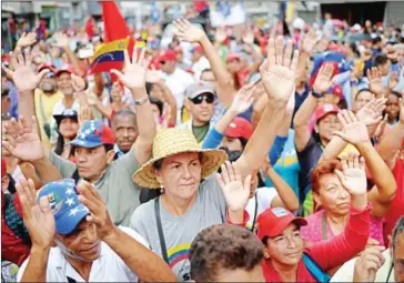  ?? FEDERICO PARRA/AFP ?? Venezuelan pro-government activists rally to express their support to the Constituen­t Assembly in Caracas on Monday.