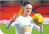  ??  ?? Ayr’s Lawrence Shankland with the match ball