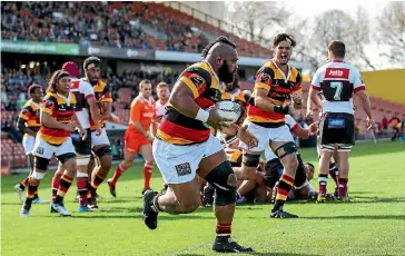  ?? PHOTO: PHOTOSPORT ?? Waikato prop Loni Uhila scores a try during the shield match against North Harbour,