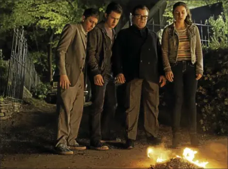  ?? PHOTO COURTESY OF SONY PICTURES ?? Things are starting to unravel for Stine and the kids as Slappy burns a manuscript in the film “Goosebumps.”