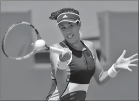  ?? Associated Press ?? Top spin it: Garbine Muguruza, of Spain, returns to Sloane Stephens during the Miami Open tennis tournament in Key Biscayne, Fla. Muguruza will be competing in the French Open tennis tournament that begins on Sunday.