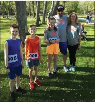  ?? ?? Family Fun: Aiden Calcarra, far left, joins the Flint family in Saturday’s Husky Hustle event. left to right: Liam Flint, Lilly Flint, Mike Flint, Krislyn Flint.