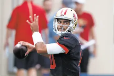  ?? Photos by David Zalubowski / Associated Press ?? Jimmy Garoppolo completed 10 of 15 passes Friday, two days after tossing five straight intercepti­ons.