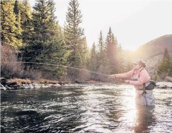  ?? RYAN DUCLOS ?? Erica Nelson casts her fly in the Taylor River in Almont, Colorado. Nelson shines a light on the topics nobody talks about in her sport.