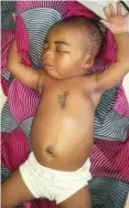  ??  ?? The new born baby with inscriptio­n on the chest
