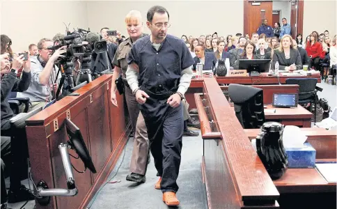  ??  ?? Larry Nassar is escorted into the courtroom during his sentencing hearing in Michigan in 2018.