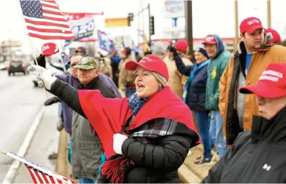  ?? Picture: AFP ?? HANDS OFF. Demonstrat­ors hold flags and signs during a pro-Trump rally for President Donald Trump at the intersecti­on of Larkin Avenue and Jefferson Street on Saturday in Joliet, Illinois.