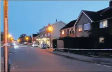  ??  ?? n CORDONED OFF: The parade in Moorfield Road, Cowley, where the shopkeeper was attacked