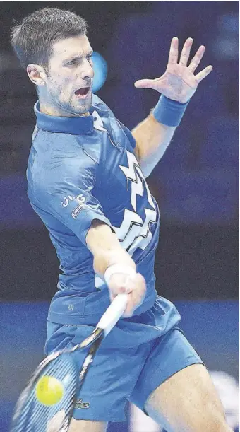  ?? (Photo: AFP) ?? Serbia’s Novak Djokovic returns to Germany’s Alexander Zverev during their men’s singles round-robin match on day six of the ATP World Tour Finals tennis tournament at the O2 Arena in London, yesterday.