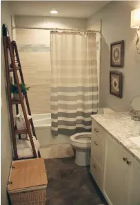  ??  ?? The master bathroom maximizes the limited space in the home.