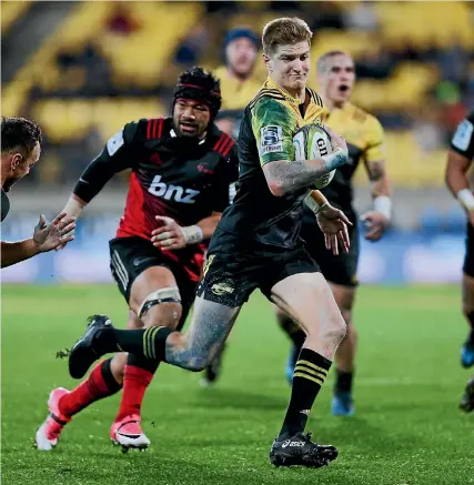  ?? GETTY IMAGES ?? Jordie Barrett glides past the Crusaders defence for a Hurricanes try at Westpac Stadium last night.