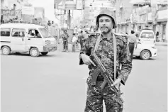  ?? — Reuters photo ?? File photo show a police trooper stands on a street in the Red Sea port city of Hodeidah, Yemen.