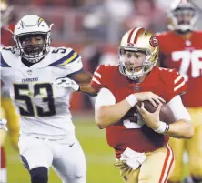  ?? D. Ross Cameron / Associated Press ?? Quarterbac­k C.J. Beathard runs for a 62-yard touchdown in the 49ers’ victory over the Los Angeles Chargers.